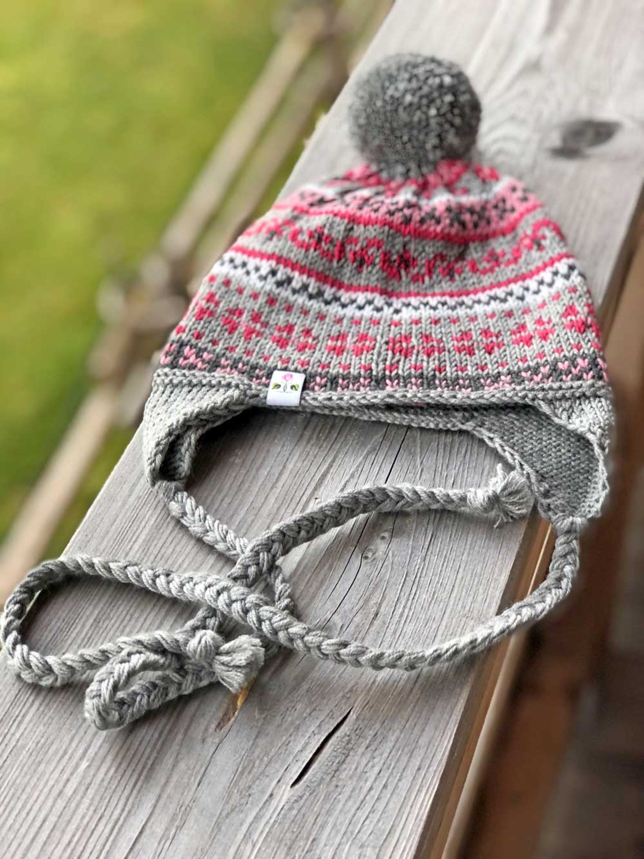 Mädels Mütze m. Bommel u. Ohrenklappe - pink-grau/